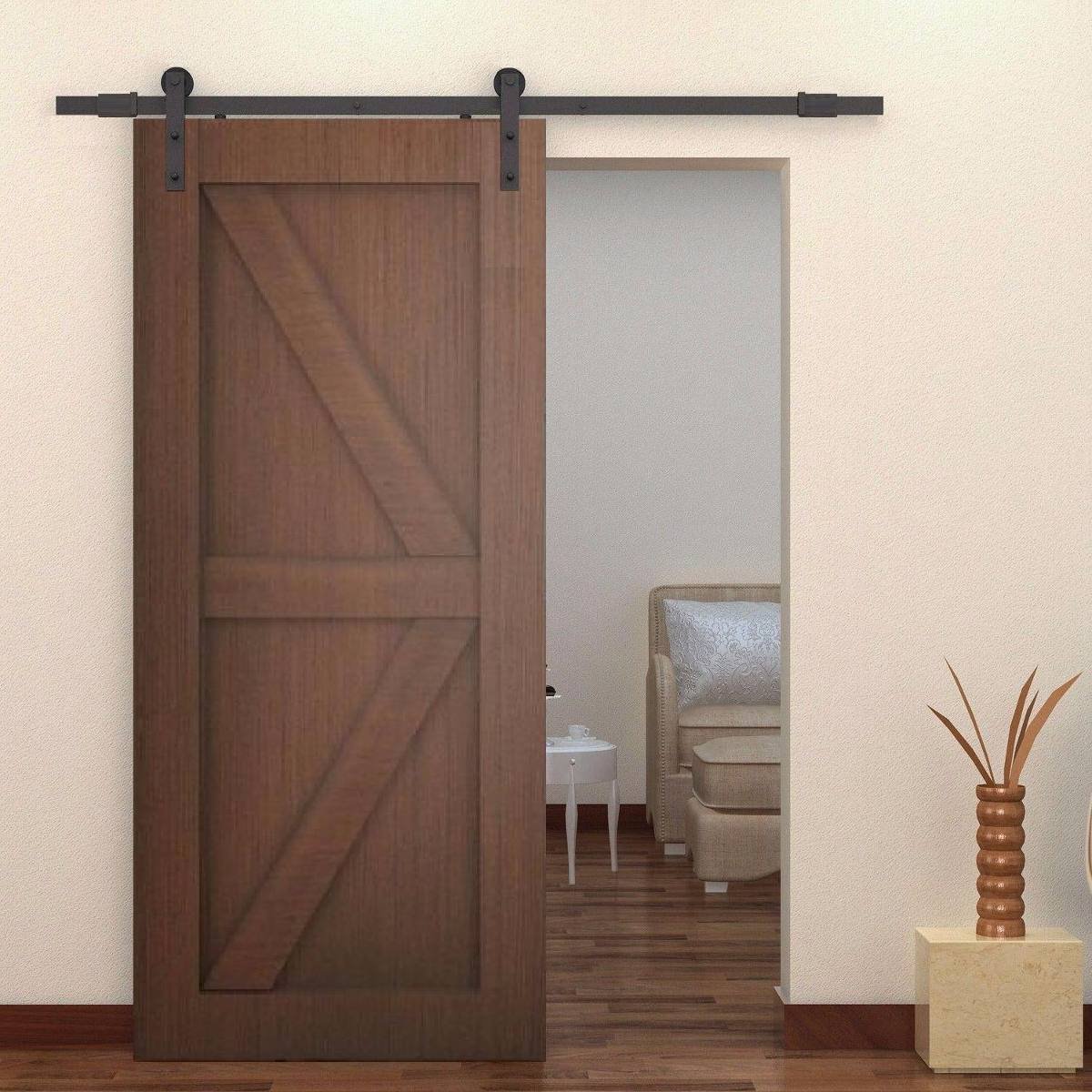 Puerta corrediza de madera realizada por Carpintería Max